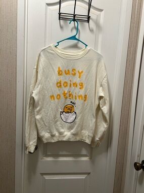 Cream Graphic Crewneck Sweatshirt with Yellow Text